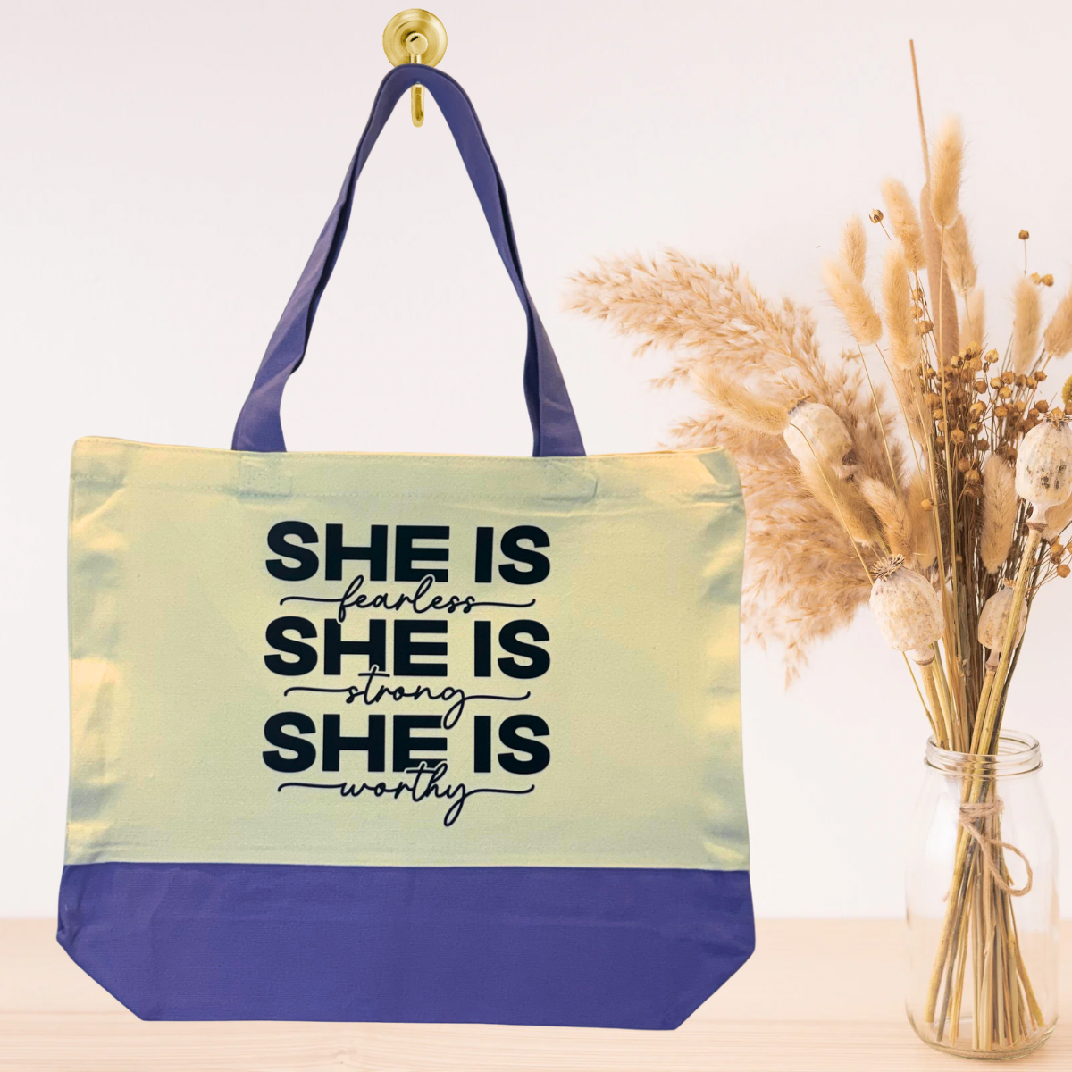 Purple eco-friendly canvas tote bag with uplifting quote design