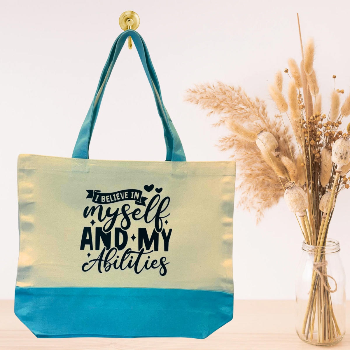 Light blue inspirational canvas tote bag with positive affirmation quote