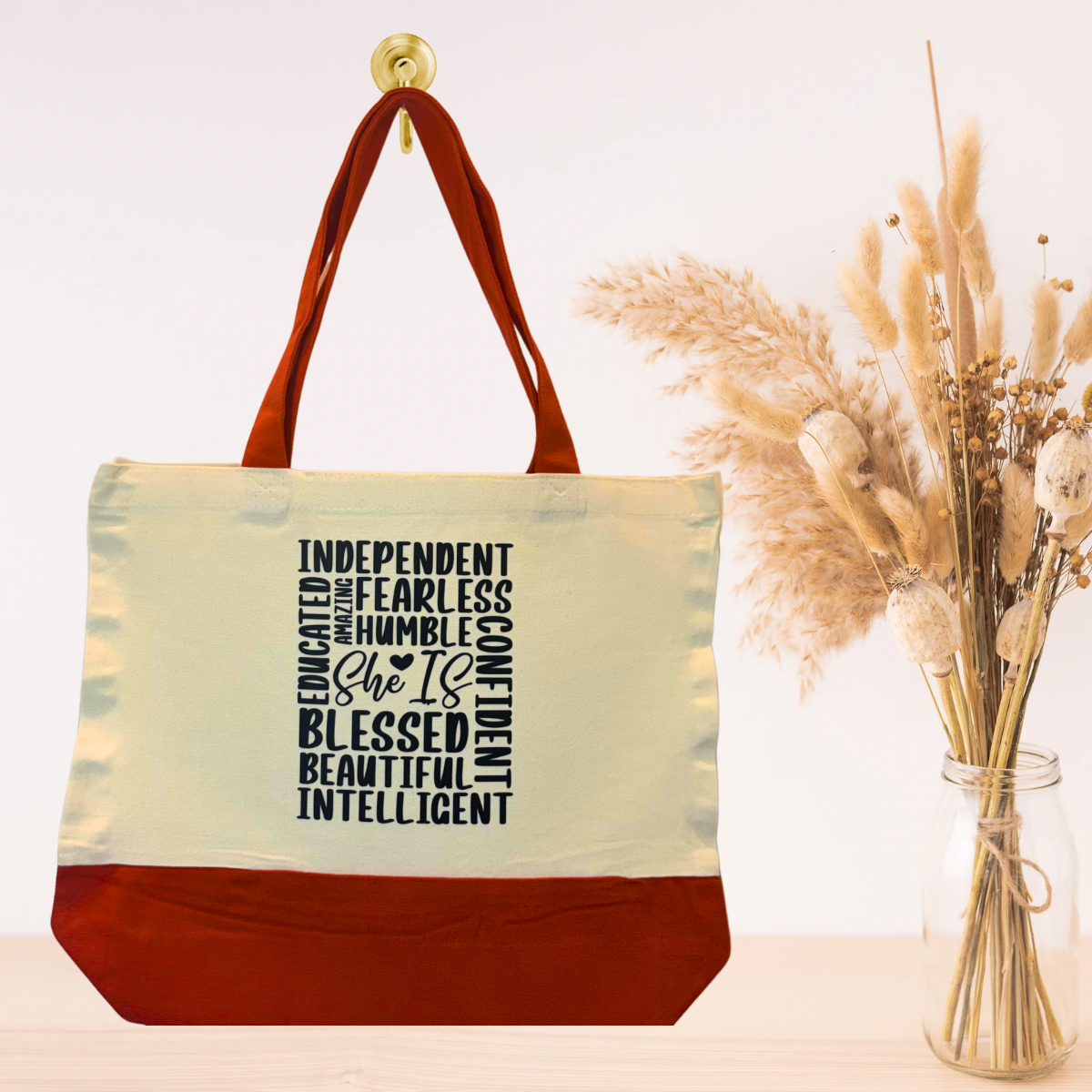 Orange reusable canvas tote bag with bold positive quote